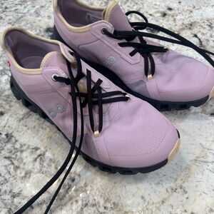 On Running Black and Pink Athletic Shoes with Minimalist Design